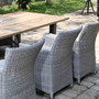Ambiente Bild  massiver Teakholz Gartentisch Marseille mit Armlehn Gartenstuehlen Lloyd, sehr komfortabler Stuhl mit wetterfestem Rehau - Geflecht