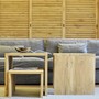 Massivholz Couchtisch U aus zertifiziertem Teak, Edelholz Teak Sofa Tisch in verschiedenen Groessen vom Schreiner in Handarbeit gefertigt, Couchtisch in modernem Design, auch als Hocker einsetzbar, im Hintergrund komfortables Sofa in der Farbe Antik und ein Kleiderschrank aus Teak Massivholz, Massivholz Moebel nach Mass Muenchen