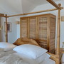 Teak massiv Schrank Sicilia Weidengeflecht Tuer- und Seitenfuellungen, hier zeigt sich der Massivholz Schrank in roh/ unbehandelt  aus der MOEBEL KOLONIE Farbpalette, Schrank aus Edelholz massiv Teak mit drei Schwingetueren, ein Schreiner Meister Stueck aus unserer MOEBEL KOLONIE Manufaktur, Schlafzimmer Moebel nach Mass Muenchen
